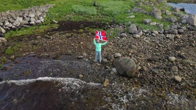 Woman with a Waving Flag of Norway.