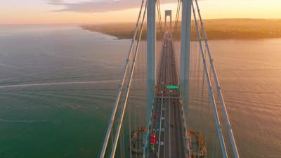 Beautiful bridge with motorways for transport. Top view. Huge structure over the river .