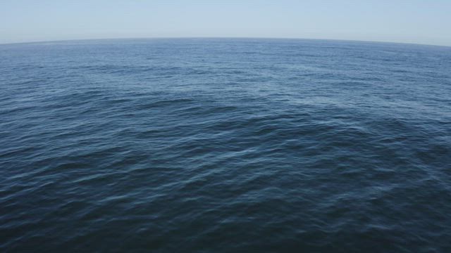 Aerial shot of calm blue sea.