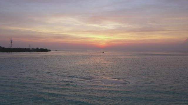 Aerial view of landscape of a calm sea at sunset.