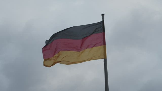 Germany waving flag moved by the wind, low view.