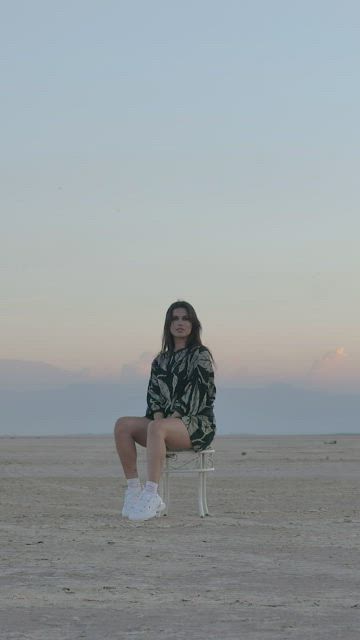 Girl posing for the camera in the middle of nowhere.