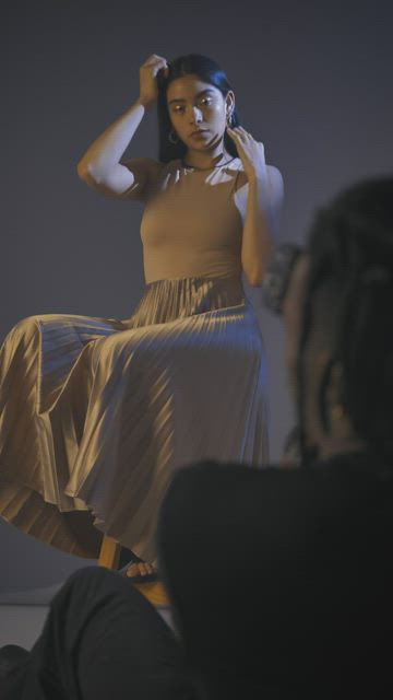 Elegantly dressed girl during a photoshoot.