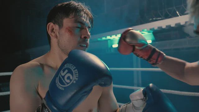 Boxer is knocked out when getting hit in a ring.